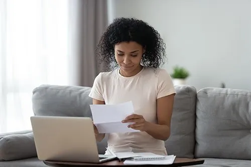 woman looking at insurance paperwork