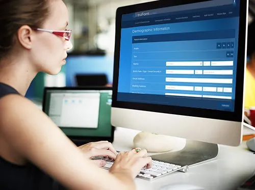 woman filling out patient registration