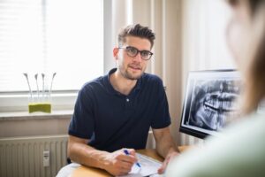 A patient discussing Dental Implants options with their oral surgeon