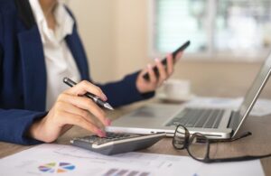 a woman running calculations to determine cashflow