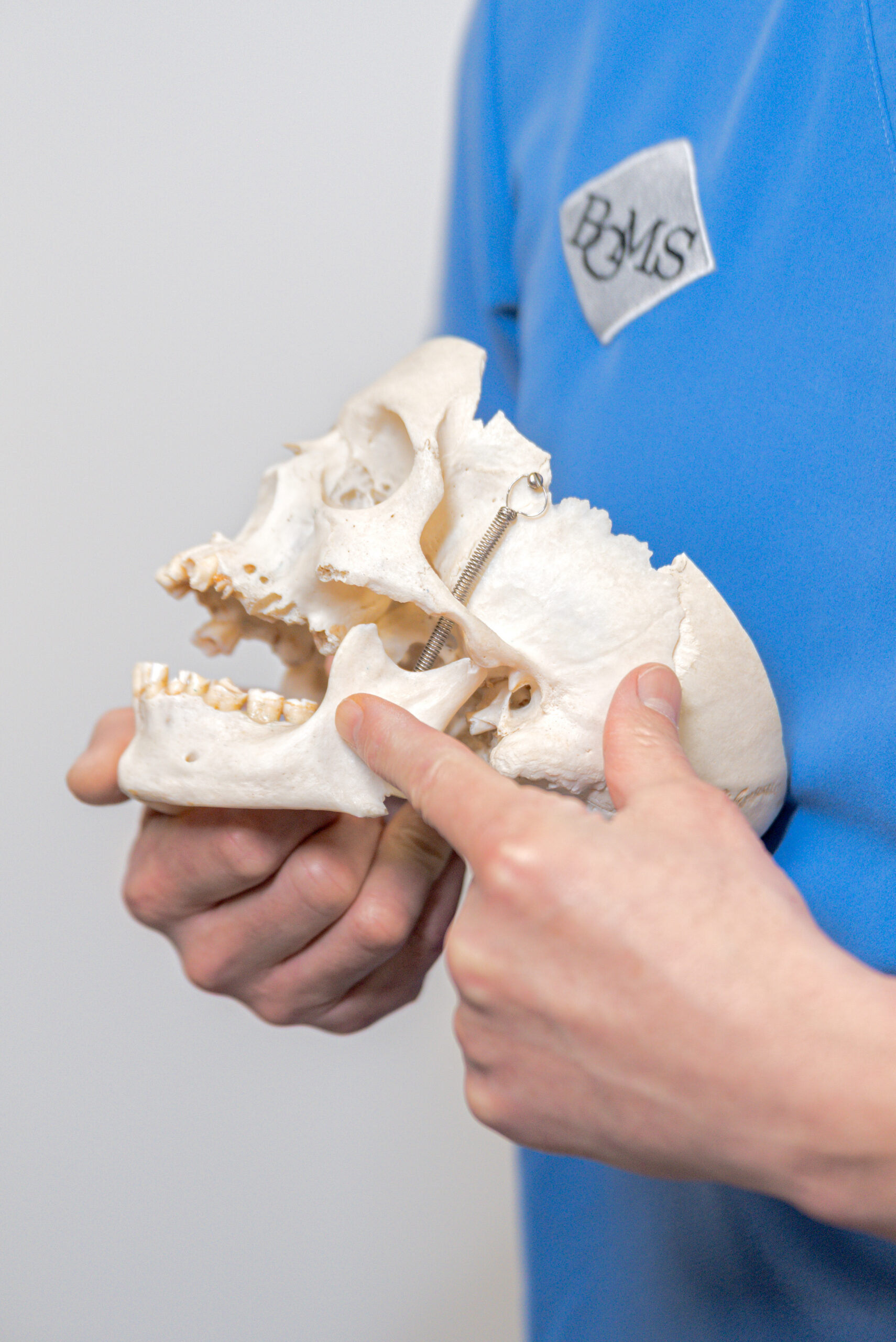 BOMS surgeon pointing to temporomandibular joint