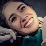woman smiling after receiving all on 4 dental implants.