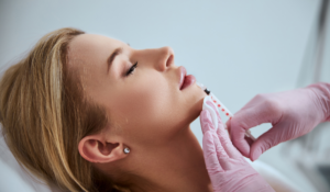 woman being injected with filler in her chin